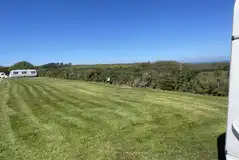Grass and hardstanding pitches (optional electric) with countryside views