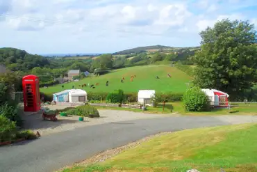 Grass and hardstanding pitches (optional electric) with countryside views