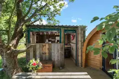 Pod private, sheltered outdoor kitchen with a fridge/freezer, hob and microwave