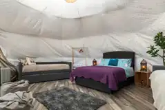 Geodome with a double bed, single beds and trundle beds