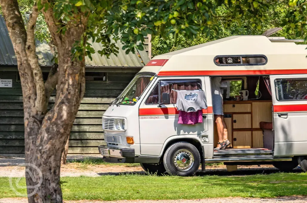 Electric grass pitches next to the facilities block