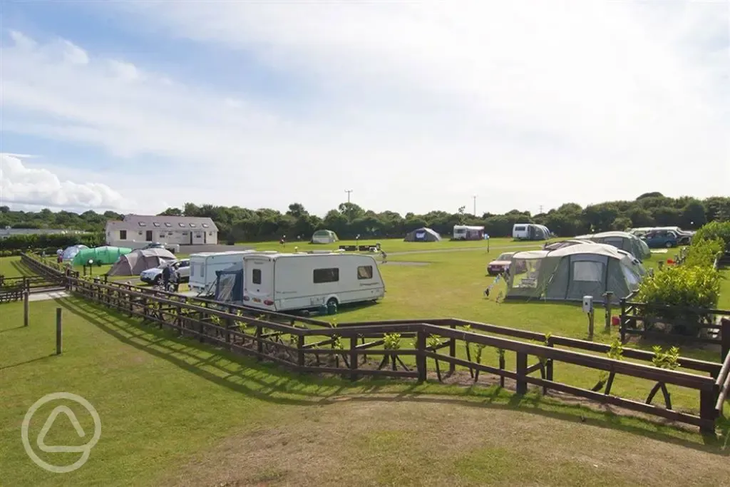 Camping field with tents and campervans 