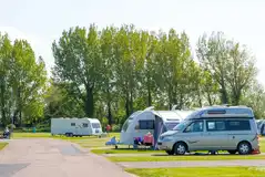 Electric hardstanding pitches (4.6m x 4.6m) in the Grove Field