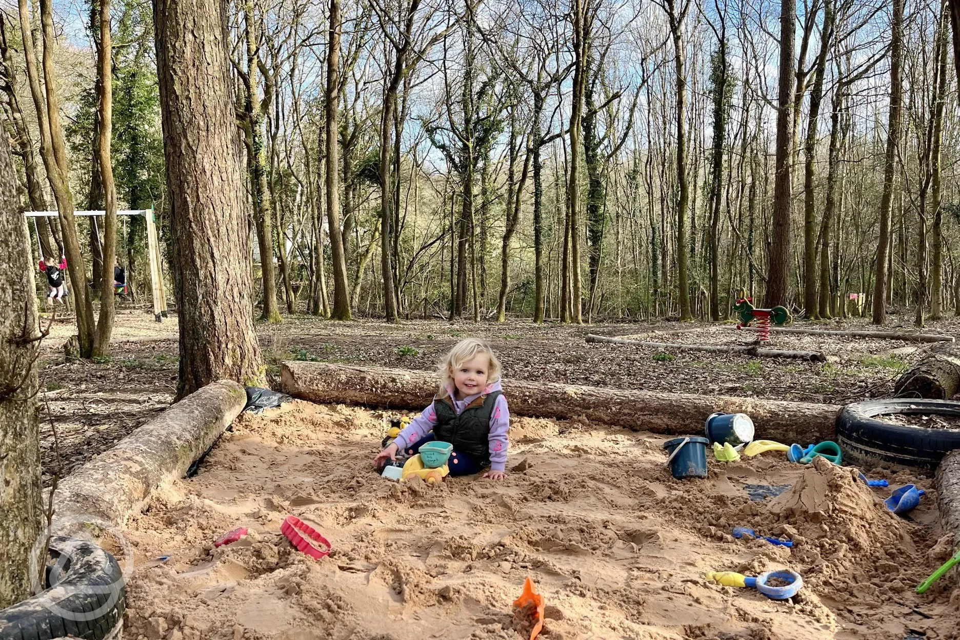 Toddler enjoying new adventure playground and den building