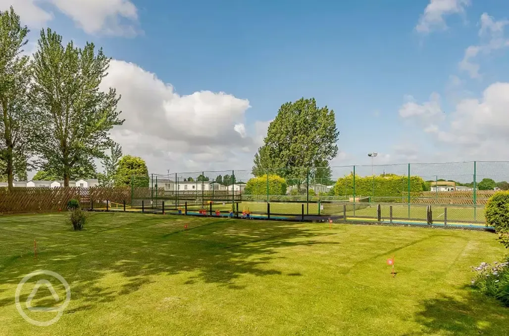 Tennis court and putting green