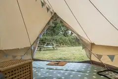 Winnie bell tent interior with electric and floor matting