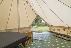 Winnie bell tent interior with electric and floor matting Winnie bell tent interior with electric and floor matting