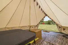 Dingle Bell bell tent interior with electric and floor matting Dingle Bell bell tent interior with electric and floor matting