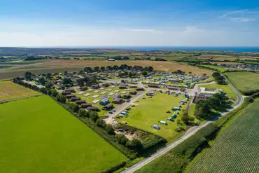 Aerial of Atlantic Bays Holiday Park camping field and lodges