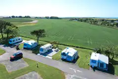 Aerial of the hardstanding pitches with countryside views Aerial of the hardstanding pitches with countryside views