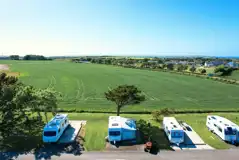 Fully serviced hardstanding touring pitches with electric, water and drainage Fully serviced hardstanding touring pitches with electric, water and drainage