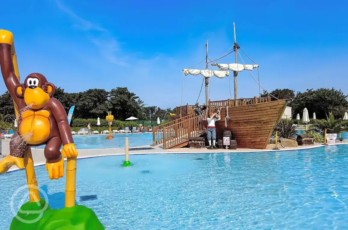 Solar heated outdoor swimming pool with pirate ship