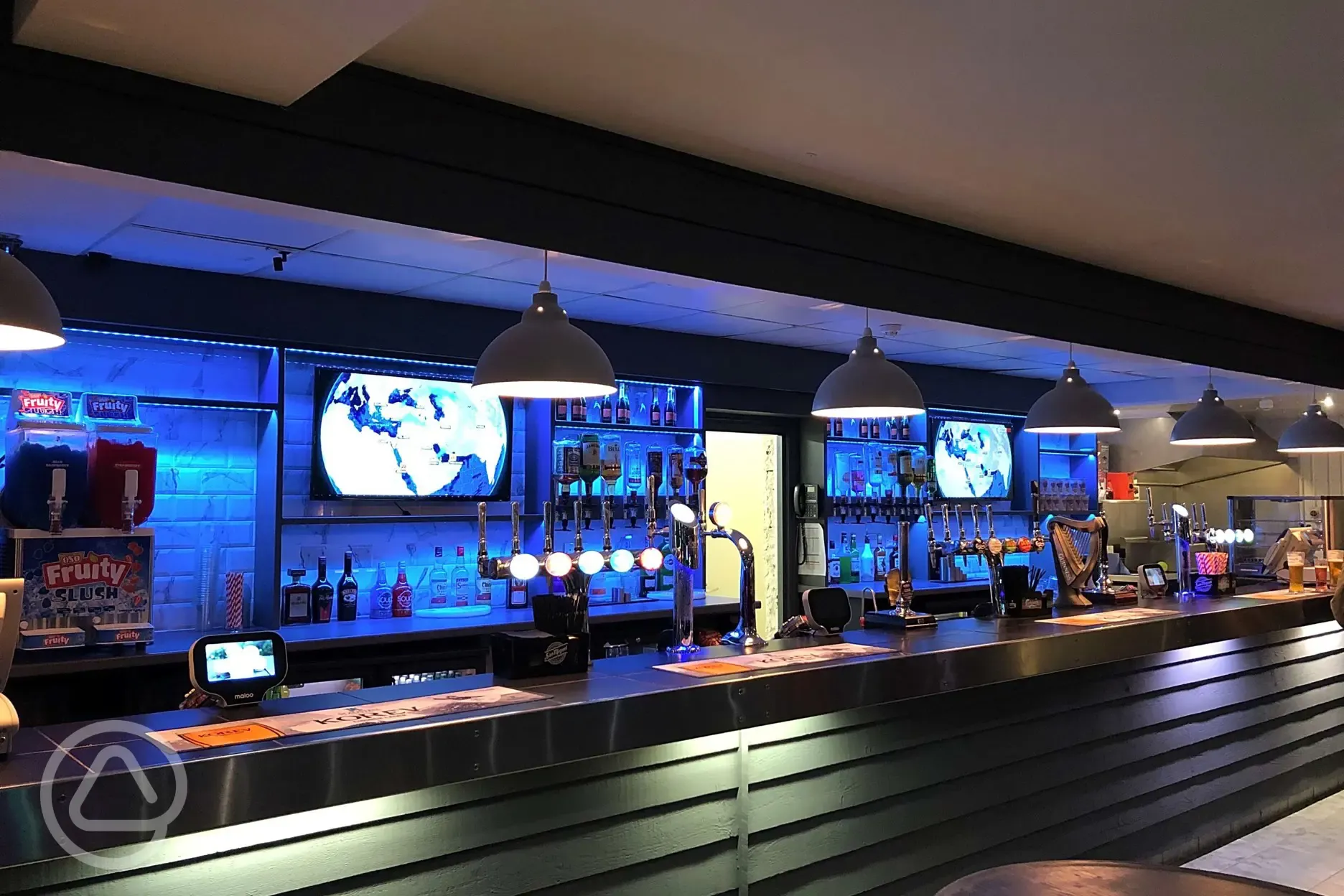 Clubhouse with bar serving drinks and bar snacks