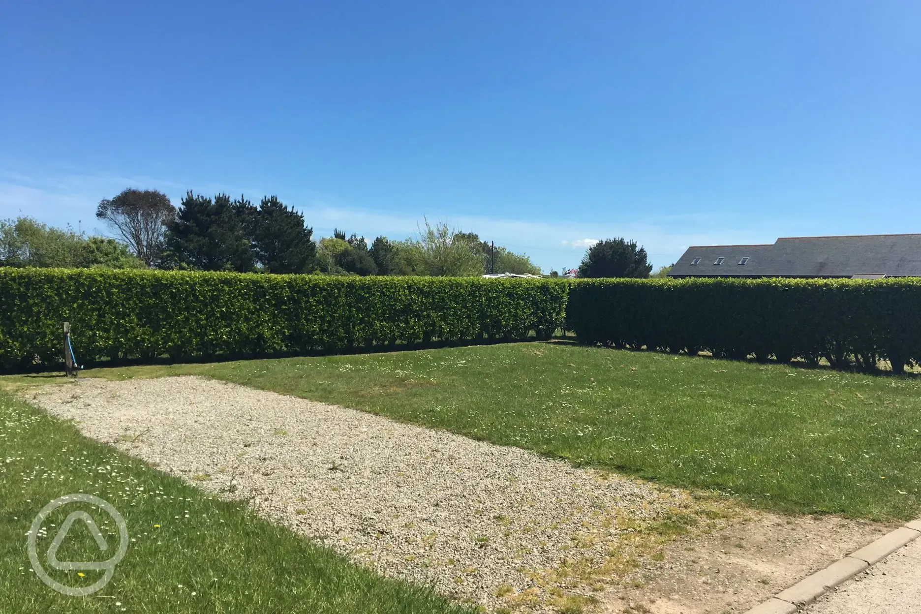 Hardstanding pitches bordered by hedges