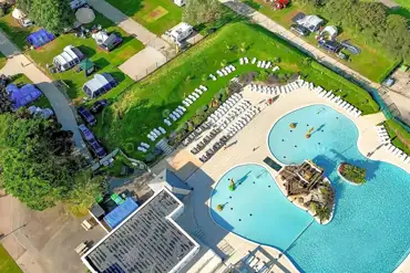 Aerial of the outdoor swimming pool, sun loungers and tent pitches