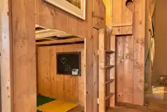 Safari tent under cabin play area