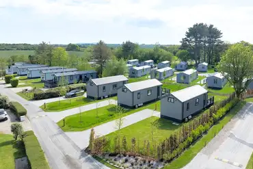 Aerial of the S-pods and static caravans at Cornish Meadows Holiday Park