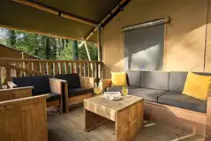 Safari tent deck with outdoor seating