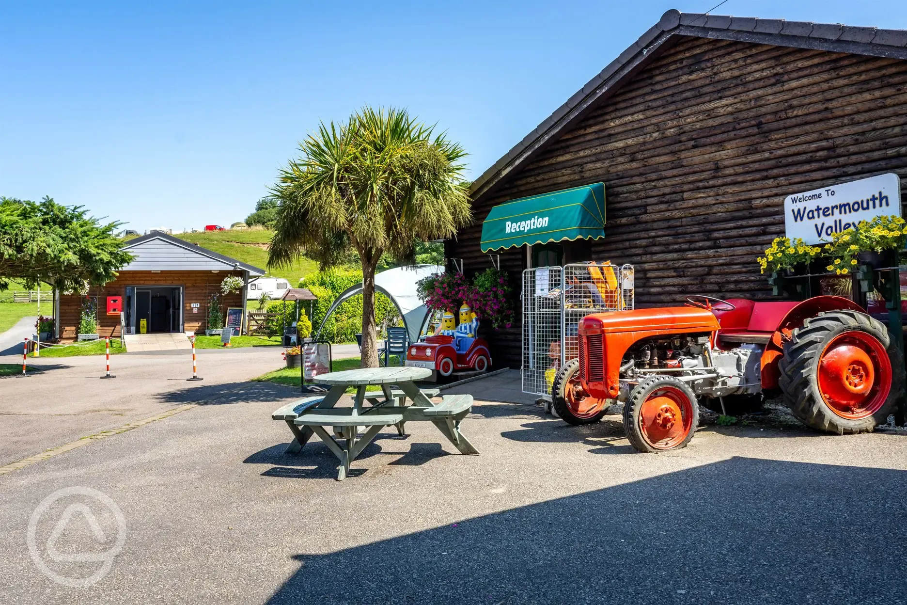 Reception area with a shop and picnic table