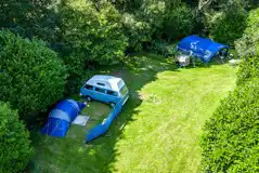 Aerial of the Valley non electric grass pitches, surrounded by trees