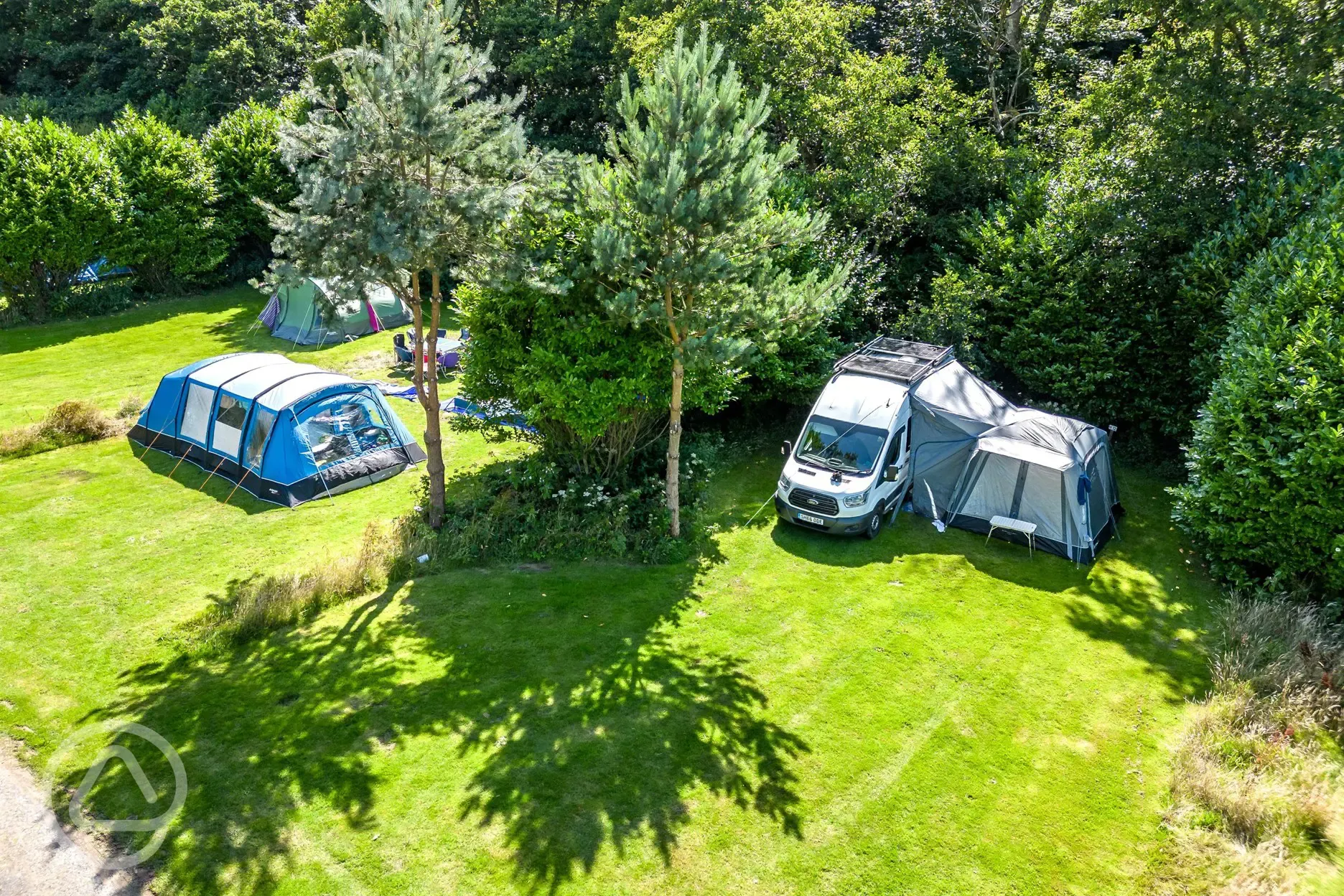 Aerial of the Valley non electric grass pitches, surrounded by trees