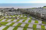 Aerial of the fully serviced hardstanding pitches and coast