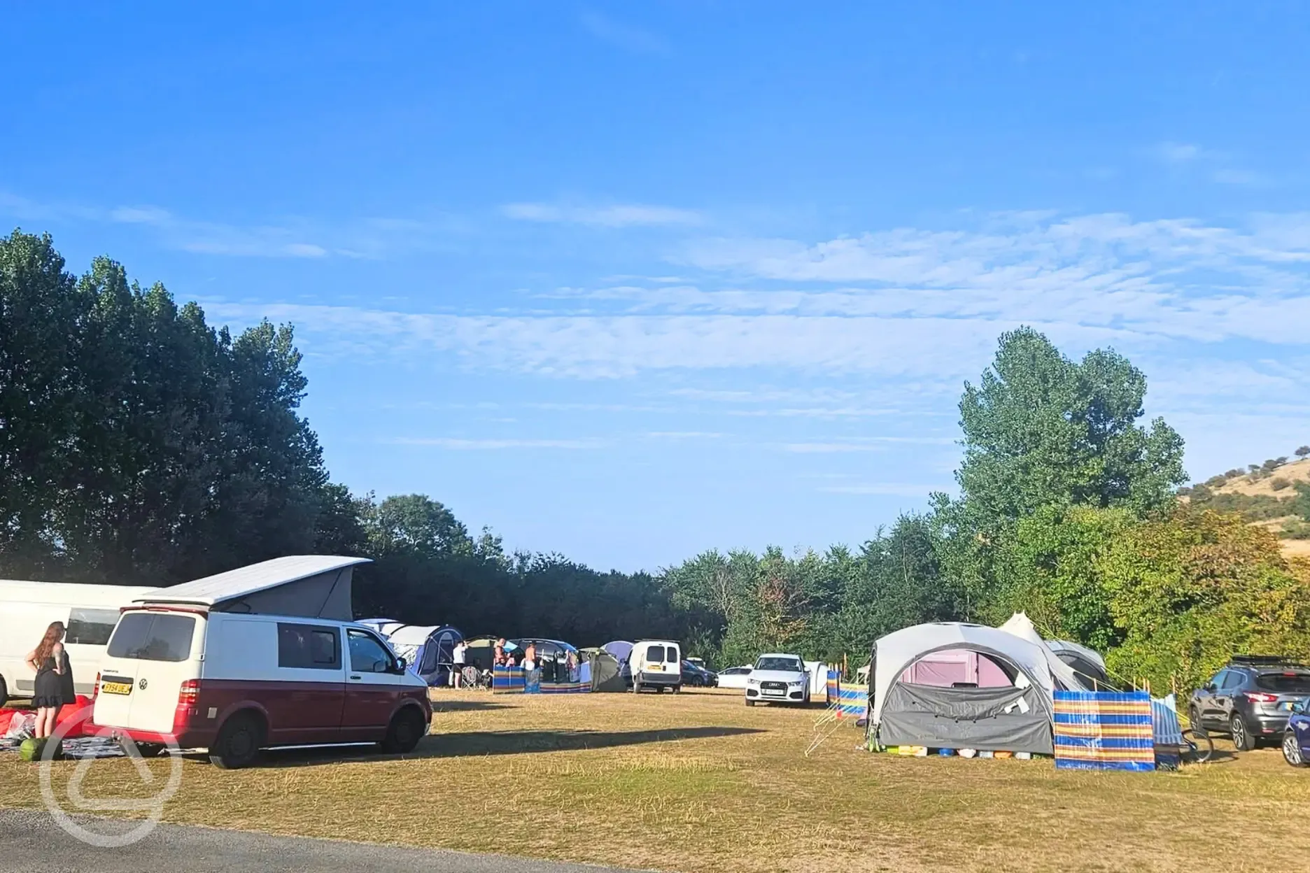 Tents and roof tents on electric grass pitches