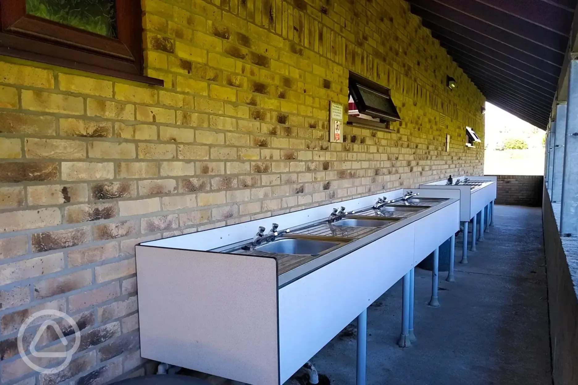 Outdoor sheltered washing up area Outdoor sheltered washing up area