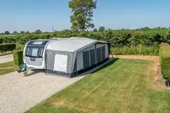 Super serviced pitches with a grass area and hedges between Super serviced pitches with a grass area and hedges between