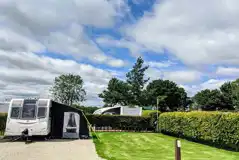 XL super serviced pitch with a private grass area and awning space