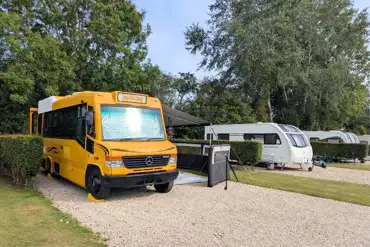 Electric hardstanding pitches with privacy hedging