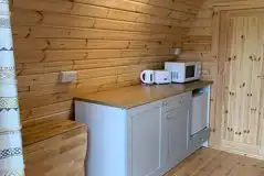 Large camping pod kitchen with kettle, toaster and microwave