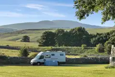 Electric grass pitches for tents and tourers