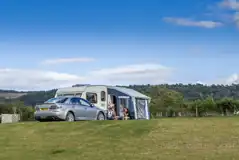 Electric grass touring pitches (10m x 6m) with awning space Electric grass touring pitches (10m x 6m) with awning space