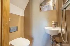 Four person glamping pod wet room with a toilet and shower