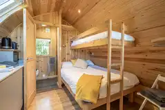 Five person glamping pods with a double bed, single bunk and double sofa bed