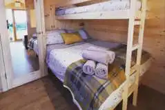 Single bunk and double bed in the Deluxe Mega Pod Single bunk and double bed in the Deluxe Mega Pod