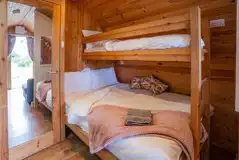 Single bunk and double bed in the Deluxe Mega Pod Single bunk and double bed in the Deluxe Mega Pod