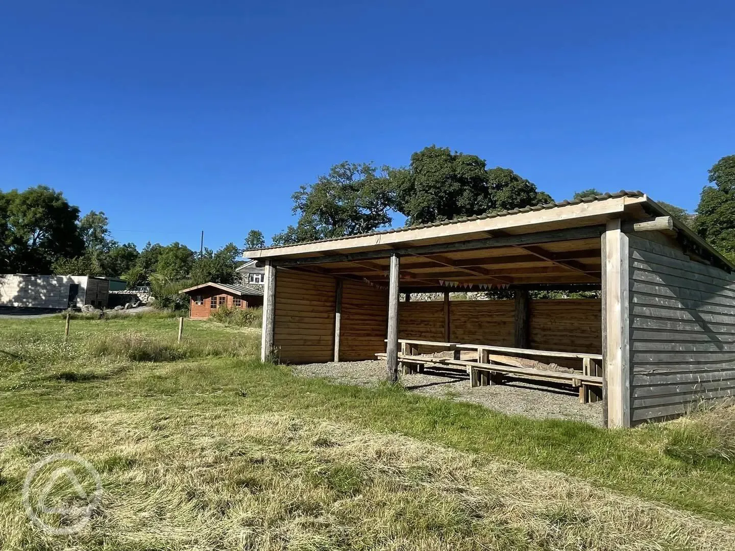 Camping shelter and picnic tables