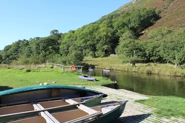 Paddleboarding on Afon Glaslyn at Llyn Gwynant Campsite