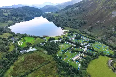 Aerial of Llyn Gwynant Campsite overlooking Llyn Gwynant lake and Afon Glaslyn