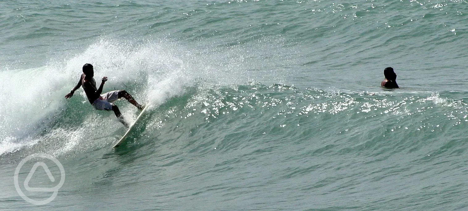 surfing at Porth Neigwl beach