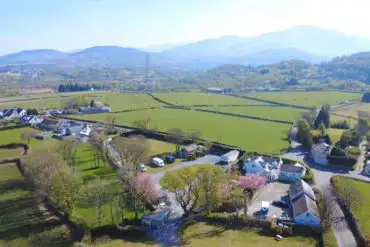 Aerial view of Llys Derwen Caravan and Campsite, surrounded by countryside