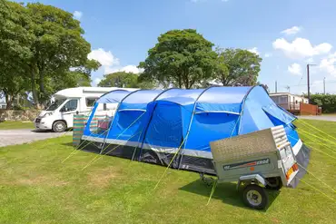 Grass tent pitches with optional electric at Llys Derwen Caravan and Campsite