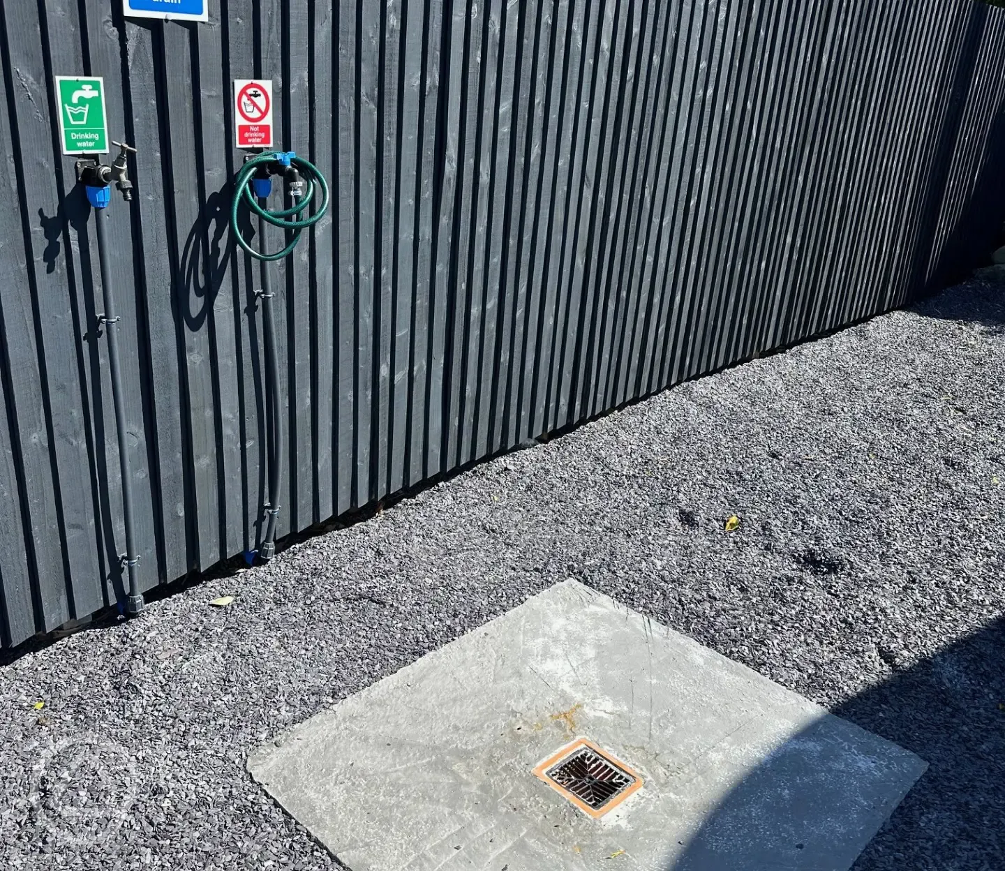 Drinking water tap and drive-over grey waste drainage point