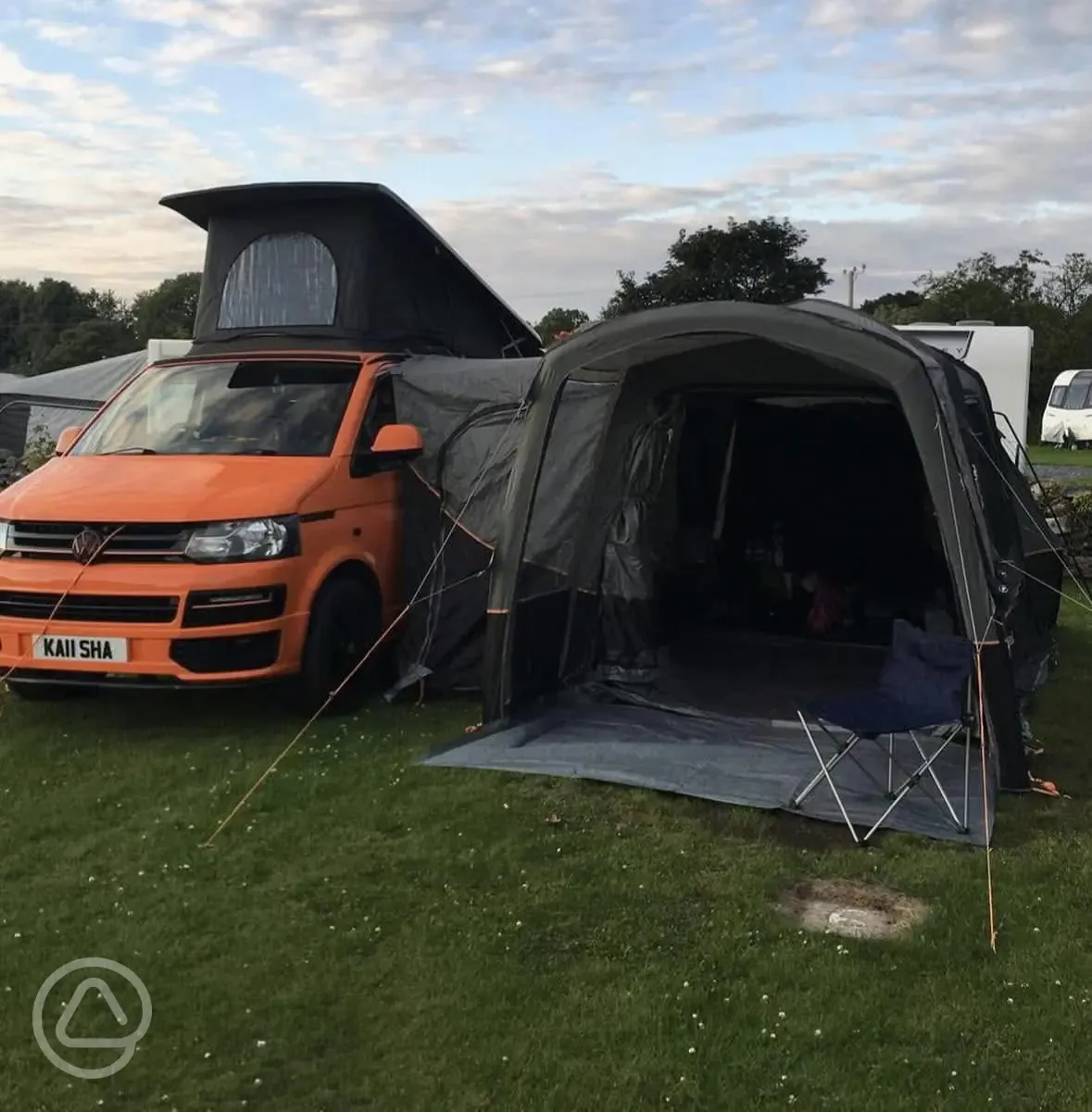 Grass pitches at Twll Y Clawdd with a roof tent 