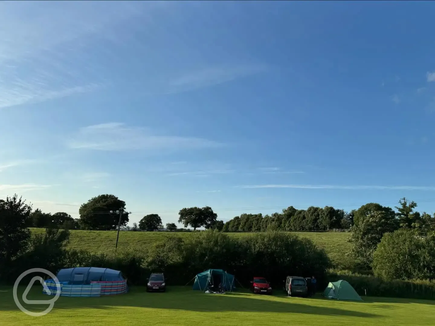 Non electric grass pitches with space for up to two cars per pitch