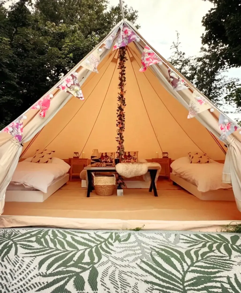 Bell tent exterior, sleeping up to four with outdoor firepit, table and chairs