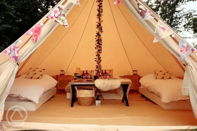 Bell tent exterior, sleeping up to four with outdoor firepit, table and chairs