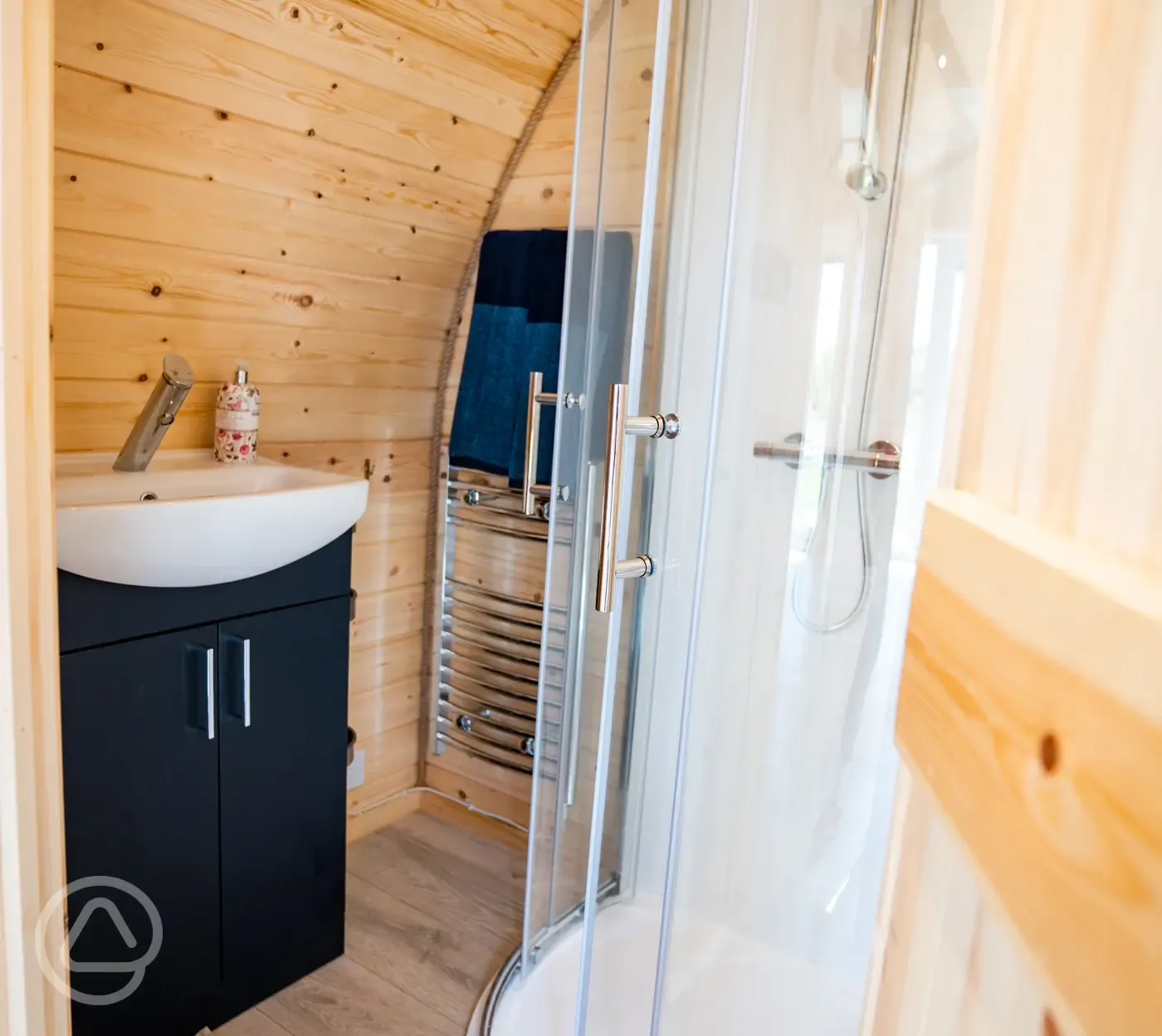 Luxury ensuite glamping pod ensuite with shower, heated towel rail and sink Luxury ensuite glamping pod ensuite with shower, heated towel rail and sink
